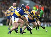 19 May 2002; David Hoey, right, and Brian Lohan of Clare in action against Eugene O'Neill of Tipperary during the Guinness Munster Senior Hurling Championship Quarter-Final match between Tipperary and Clare at Páirc U’ Chaoimh in Cork. Photo by Brendan Moran/Sportsfile