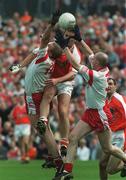 19 May 2002; Tony McEntee of Armagh in action against Sean Teague, left, and Chris Lawn, Tyrone during the Bank of Ireland Ulster Senior Football Championship Quarter-Final match between Armagh and Tyrone at St Tiernach's Park in Clones, Monaghan. Photo by Pat Murphy/Sportsfile