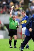 19 May 2002; Referee Pat Horan shows a yellow card to Conor Gleeson of Tipperary during the Guinness Munster Senior Hurling Championship Quarter-Final match between Tipperary and Clare at Páirc U’ Chaoimh in Cork. Photo by Brendan Moran/Sportsfile