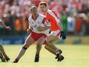 19 May 2002; Cormac McAnallan of Tyrone in action against Paul McGrane of Armagh during the Bank of Ireland Ulster Senior Football Championship Quarter-Final match between Armagh and Tyrone at St Tiernach's Park in Clones, Monaghan. Photo by Aoife Rice/Sportsfile
