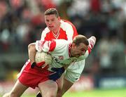 19 May 2002; Gerard Cavlan of Tyrone in action against John Toal of Armagh during the Bank of Ireland Ulster Senior Football Championship Quarter-Final match between Armagh and Tyrone at St Tiernach's Park in Clones, Monaghan. Photo by Aoife Rice/Sportsfile