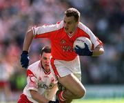 19 May 2002; Paddy McKeever of Armagh in action against Tyrone's Conor Gormley during the Bank of Ireland Ulster Senior Football Championship Quarter-Final match between Armagh and Tyrone at St Tiernach's Park in Clones, Monaghan. Photo by Aoife Rice/Sportsfile