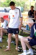 23 May 2002; Steve Finnan, who received attention from team doctor Martin Walsh to his injured foot, during a Republic of Ireland squad training session at Ada Gym in Susupe, Saipan, Northern Mariana Islands. Photo by David Maher/Sportsfile