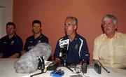 23 May 2002; Republic of Ireland manager Mick McCarthy, centre, with players Alan Kelly and Niall Quinn, left, and FAI President Milo Corcoran, right, during a press conference to announce the departure from the squad of captain Roy Keane, at The Hyatt Hotel in Mutcho, Saipan, Northern Mariana Islands. Photo by David Maher/Sportsfile