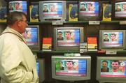 23 May 2002; Brendan Raythorn, from Ringsend, Dublin, watches Sky Sports News breaking story of Republic of Ireland captain Roy Keane's departure from the squad in Saipan, Northern Mariana Islands, ahead of the FIFA World Cup 2002 finals in South Korea and Japan. Photo by Damien Eagers/Sportsfile