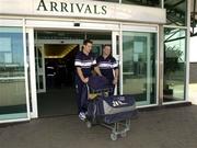 23 May 2002; Munster players David Wallace, left, and Frank Sheahan arrive at Cardiff Airport ahead of their Heineken Cup Final match against Leicester Tigers at the Millennium Stadium in Cardiff, Wales. Photo by Brendan Moran/Sportsfile