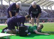 25 May 2002; Jason McAteer of Republic of Ireland is attended to by Ciaran Murray, team's chartered physiotherapist, physiotherapist Mick Byrne, right, and team doctor Martin Walsh during the friendly match between Sanfrecce Hiroshima and Republic of Ireland at Hamayama Park in Izumo, Japan. Photo by David Maher/Sportsfile