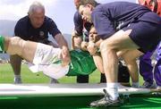 25 May 2002; Jason McAteer of Republic of Ireland is placed on a stretcher by physiotherapist Mick Byrne, left, team doctor Martin Walsh and chartered physiotherapist, Ciaran Murray during the friendly match between Sanfrecce Hiroshima and Republic of Ireland at Hamayama Park in Izumo, Japan. Photo by David Maher/Sportsfile