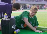 25 May 2002; Jason McAteer of Republic of Ireland lies injured during the friendly match between Sanfrecce Hiroshima and Republic of Ireland at Hamayama Park in Izumo, Japan. Photo by David Maher/Sportsfile