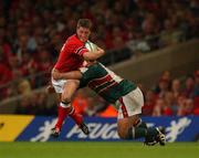 25 May 2002; Ronan O'Gara of Munster is tackled by Leicester's Darren Garforth during the Heineken Cup Final match between Leicester Tigers and Munster at the Millennium Stadium in Cardiff, Wales. Photo by Brendan Moran/Sportsfile