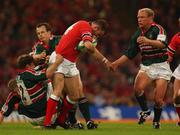 25 May 2002; John Kelly of Munster is tackled by Leicester's Neil Back, right, Rod Kafer, left, and Austin Healey during the Heineken Cup Final match between Leicester Tigers and Munster at the Millennium Stadium in Cardiff, Wales. Photo by Brendan Moran/Sportsfile
