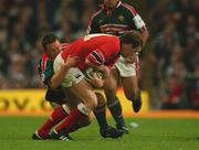 25 May 2002; John O'Neill of Munster is tackled by Leicester's Rod Kafer during the Heineken Cup Final match between Leicester Tigers and Munster at the Millennium Stadium in Cardiff, Wales. Photo by Brendan Moran/Sportsfile