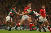 25 May 2002; Rob Henderson of Munster is tackled by Leicester players Rob Kafer, right, and Harry Ellis during the Heineken Cup Final match between Leicester Tigers and Munster at the Millennium Stadium in Cardiff, Wales. Photo by Matt Browne/Sportsfile