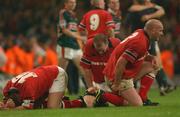 25 May 2002; Munster players, from left, Marcus Horan, Frank Sheahan and John Hayes at the final whistle following their side's defeat during the Heineken Cup Final match between Leicester Tigers and Munster at the Millennium Stadium in Cardiff, Wales. Photo by Matt Browne/Sportsfile