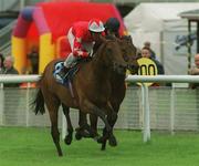 25 May 2002; Rock of Gibraltar, with Mick Kinnane up, races clear of Century City, with Seamus Heffernan, on their way to winning the Entenmann's Irish 2000 Guineas at The Curragh Racecourse in Kildare. Photo by Sportsfile