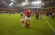 25 May 2002; Munster captain Mick Galwey with his daughters Ailbhe and Neasa following his side's defeat during the Heineken Cup Final match between Leicester Tigers and Munster at the Millennium Stadium in Cardiff, Wales. Photo by Brendan Moran/Sportsfile