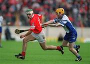 26 May 2002; Cork's Niall McCarthy races clear of Waterford's Eoin Murphy during the Guinness Munster Senior Hurling Championship Semi-Final match between Waterford and Cork at Semple Stadium in Thurles, Tipperary. Photo by Brendan Moran/Sportsfile