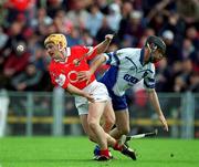 26 May 2002; Cork's Joe Deane in a tussle for possession with Waterford's James Murray during the Guinness Munster Senior Hurling Championship Semi-Final match between Waterford and Cork at Semple Stadium in Thurles, Tipperary. Photo by Brendan Moran/Sportsfile