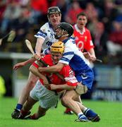 26 May 2002; Cork's Joe Deane is tackled by Waterford's James Murray, right, and Fergal Hartley during the Guinness Munster Senior Hurling Championship Semi-Final match between Waterford and Cork at Semple Stadium in Thurles, Tipperary. Photo by Brendan Moran/Sportsfile