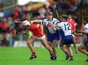 26 May 2002; Cork's Timmy McCarthy races clear of Waterford's Fergal Hartley and Dave Bennett, right, during the Guinness Munster Senior Hurling Championship Semi-Final match between Waterford and Cork at Semple Stadium in Thurles, Tipperary. Photo by Brendan Moran/Sportsfile