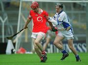 26 May 2002; Cork's Vincent Hurley is tackled by Waterford's Stephen Cunningham during the Munster Intermediate Hurling Championship match between Waterford and Cork at Semple Stadium in Thurles, Tipperary. Photo by Brendan Moran/Sportsfile