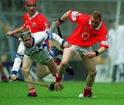26 May 2002; Cork's Will Twomey is tackled by Waterford's Stephen Cunningham during the Munster Intermediate Hurling Championship match between Waterford and Cork at Semple Stadium in Thurles, Tipperary. Photo by Brendan Moran/Sportsfile