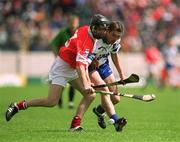 26 May 2002; Ben O'Connor of Cork in action against Tony Browne of Waterford during the Guinness Munster Senior Hurling Championship Semi-Final match between Waterford and Cork at Semple Stadium in Thurles, Tipperary. Photo by Brendan Moran/Sportsfile