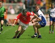 26 May 2002; Ben O'Connor of Cork in action against Brian Flannery of Waterford during the Guinness Munster Senior Hurling Championship Semi-Final match between Waterford and Cork at Semple Stadium in Thurles, Tipperary. Photo by Brendan Moran/Sportsfile
