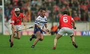 26 May 2002; Peter Queally of Waterford in action against Timmy McCarthy and John Browne of Cork during the Guinness Munster Senior Hurling Championship Semi-Final match between Waterford and Cork at Semple Stadium in Thurles, Tipperary. Photo by Brendan Moran/Sportsfile