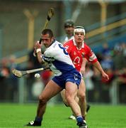 26 May 2002; Peter Queally of Waterford in action against Niall McCarthy of Cork during the Guinness Munster Senior Hurling Championship Semi-Final match between Waterford and Cork at Semple Stadium in Thurles, Tipperary. Photo by Brendan Moran/Sportsfile