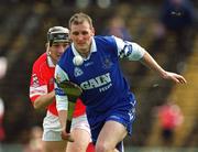 26 May 2002; Stephen Brenner of Waterford in action against Eamonn Collins of Cork during the Guinness Munster Senior Hurling Championship Semi-Final match between Waterford and Cork at Semple Stadium in Thurles, Tipperary. Photo by Brendan Moran/Sportsfile