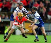26 May 2002; Joe Deane of Cork in action against Waterford's Fergal Hartley, left, and James Murray during the Guinness Munster Senior Hurling Championship Semi-Final match between Waterford and Cork at Semple Stadium in Thurles, Tipperary. Photo by Brendan Moran/Sportsfile