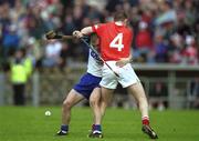 26 May 2002; Waterford's Eoin McGrath contests possession with Cork's Fergal Ryan during the Guinness Munster Senior Hurling Championship Semi-Final match between Waterford and Cork at Semple Stadium in Thurles, Tipperary. Photo by Brendan Moran/Sportsfile