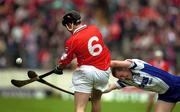 26 May 2002; Waterford's Ken McGrath attempts to block a clearance by Cork's John Browne during the Guinness Munster Senior Hurling Championship Semi-Final match between Waterford and Cork at Semple Stadium in Thurles, Tipperary. Photo by Brendan Moran/Sportsfile