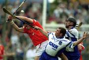 26 May 2002; Cork's Seán Óg Ó hAilpín contests a high ball with Waterford's Brian Greene, centre, and Seamus Prendergast during the Guinness Munster Senior Hurling Championship Semi-Final match between Waterford and Cork at Semple Stadium in Thurles, Tipperary. Photo by Brendan Moran/Sportsfile