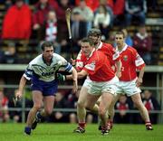 26 May 2002; Waterford's Tony Browne gets clear of Cork's John Browne and Wayne Sherlock during the Guinness Munster Senior Hurling Championship Semi-Final match between Waterford and Cork at Semple Stadium in Thurles, Tipperary. Photo by Brendan Moran/Sportsfile