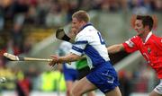 26 May 2002; Brian Flannery of Waterford in action against Alan Cummins of Cork during the Guinness Munster Senior Hurling Championship Semi-Final match between Waterford and Cork at Semple Stadium in Thurles, Tipperary. Photo by Brendan Moran/Sportsfile
