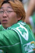 27 May 2002; A local watches the action wearing an Ireland scarf during a Republic of Ireland squad training session at Izumo Sports Park in Izumo, Japan. Photo by David Maher/Sportsfile