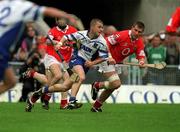 26 May 2002; Eoin Kelly of Waterford is tackled by Jerry O'Connor and Diarmuid O'Sullivan of Cork during the Guinness Munster Senior Hurling Championship Semi-Final match between Waterford and Cork at Semple Stadium in Thurles, Tipperary. Photo by Brendan Moran/Sportsfile