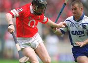 26 May 2002; Wayne Sherlock of Cork in action against Eoin Kelly of Waterford during the Guinness Munster Senior Hurling Championship Semi-Final match between Waterford and Cork at Semple Stadium in Thurles, Tipperary. Photo by Brendan Moran/Sportsfile