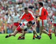 26 May 2002; Tyrone's Conor Gormley in action against Diarmuid Marsden of Armagh during the Bank of Ireland Ulster Senior Football Championship Quarter-Final Replay match between Armagh and Tyrone at St Tiernach's Park in Clones, Monaghan. Photo by Aoife Rice/Sportsfile