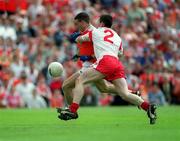 26 May 2002; Armagh's Diarmuid Marsden in action against Conor Gormley of Tyrone during the Bank of Ireland Ulster Senior Football Championship Quarter-Final Replay match between Armagh and Tyrone at St Tiernach's Park in Clones, Monaghan. Photo by Aoife Rice/Sportsfile