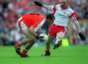 26 May 2002; Armagh's Steven McDonnell in action against Chris Lawn of Tyrone during the Bank of Ireland Ulster Senior Football Championship Quarter-Final Replay match between Armagh and Tyrone at St Tiernach's Park in Clones, Monaghan. Photo by Aoife Rice/Sportsfile