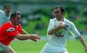 26 May 2002; Tadhg Fennin of Kildare in action against Alan Page of Louth during the Bank of Ireland Leinster Senior Football Championship Quarter-Final match between Kildare and Louth at Páirc Tailteann in Navan, Meath. Photo by Pat Murphy/Sportsfile