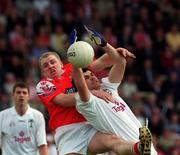 26 May 2002; Martin Lynch of Kildare in action against Aaron Hoey of Louth during the Bank of Ireland Leinster Senior Football Championship Quarter-Final match between Kildare and Louth at Páirc Tailteann in Navan, Meath. Photo by Pat Murphy/Sportsfile