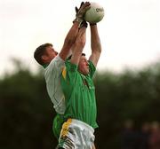 26 May 2002; Paul McDermott of Leitrim contests a dropping ball with London's Kevin Waldron during the Bank of Ireland Connacht Senior Football Championship Quarter-Final match between London and Leitrim at the Emerald GAA Grounds in Ruislip, London, England. Photo by Brian Lawless/Sportsfile