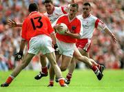26 May 2002; Armagh's Paddy McKeever in action against Colin Holmes of Tyrone during the Bank of Ireland Ulster Senior Football Championship Quarter-Final Replay match between Armagh and Tyrone at St Tiernach's Park in Clones, Monaghan. Photo by Aoife Rice/Sportsfile