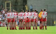 26 May 2002; Tyrone players during the national anthem prior to the Bank of Ireland Ulster Senior Football Championship Quarter-Final Replay match between Armagh and Tyrone at St Tiernach's Park in Clones, Monaghan. Photo by Aoife Rice/Sportsfile