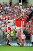 26 May 2002; Paul McGrane of Armagh contests a high ball with Cormac McAnallen of Tyrone during the Bank of Ireland Ulster Senior Football Championship Quarter-Final Replay match between Armagh and Tyrone at St Tiernach's Park in Clones, Monaghan. Photo by Aoife Rice/Sportsfile