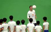 29 May 2002; Robbie Keane shows off his skills to local school children during a Republic of Ireland squad training session at Izumo Sports Park in Izumo, Japan. Photo by David Maher/Sportsfile